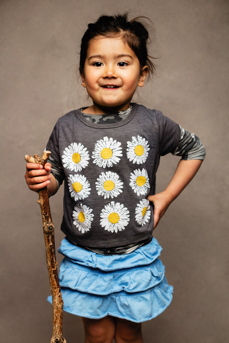 A studio portrait of an adorable, cute 3-year-old girl who loves hiking with her Mom, Dad and brother. She likes to use her hiking stick when going on walks. This portrait was created by Steve Glass, owner of Glass Photography Portrait Studio. In all of his portraits he is seeking the Imago Dei – the image of God – in each of his subjects. This means uncovering the unique interests, creativity, ingenuity and beauty that each person possesses. This deepest portion of a person that is created in the image of God, the Imago Dei. Steve Glass, a professional portrait photographer of Glass Photography services the men, women, children, kids, families, business and people of Fort Collins, Windsor, Loveland, Wellington and the surrounding areas of Northern Colorado and southern Wyoming (and sometime Denver), through professional photography by creating timeless portraits and heirloom prints, ranging from corporate portraits, corporate headshots, environmental portraits, editorial portraits, and beauty portraits.